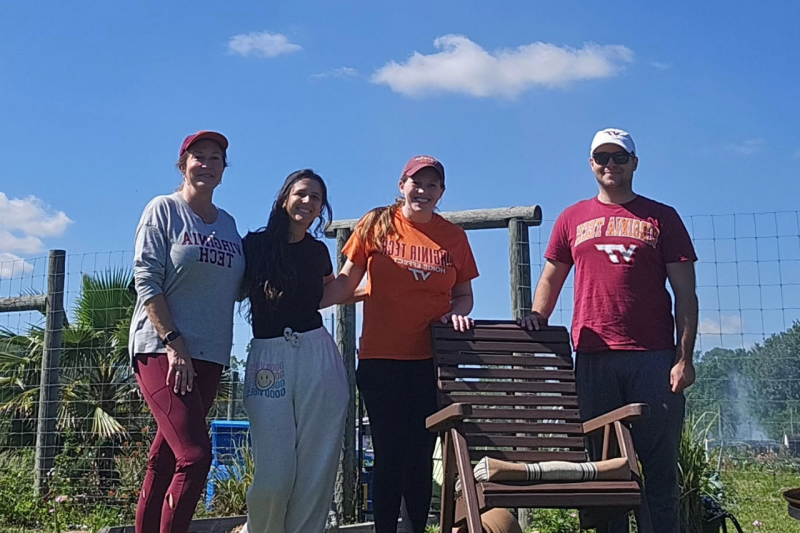 Jacksonville Hokies pose for a photo during a cleanup service event